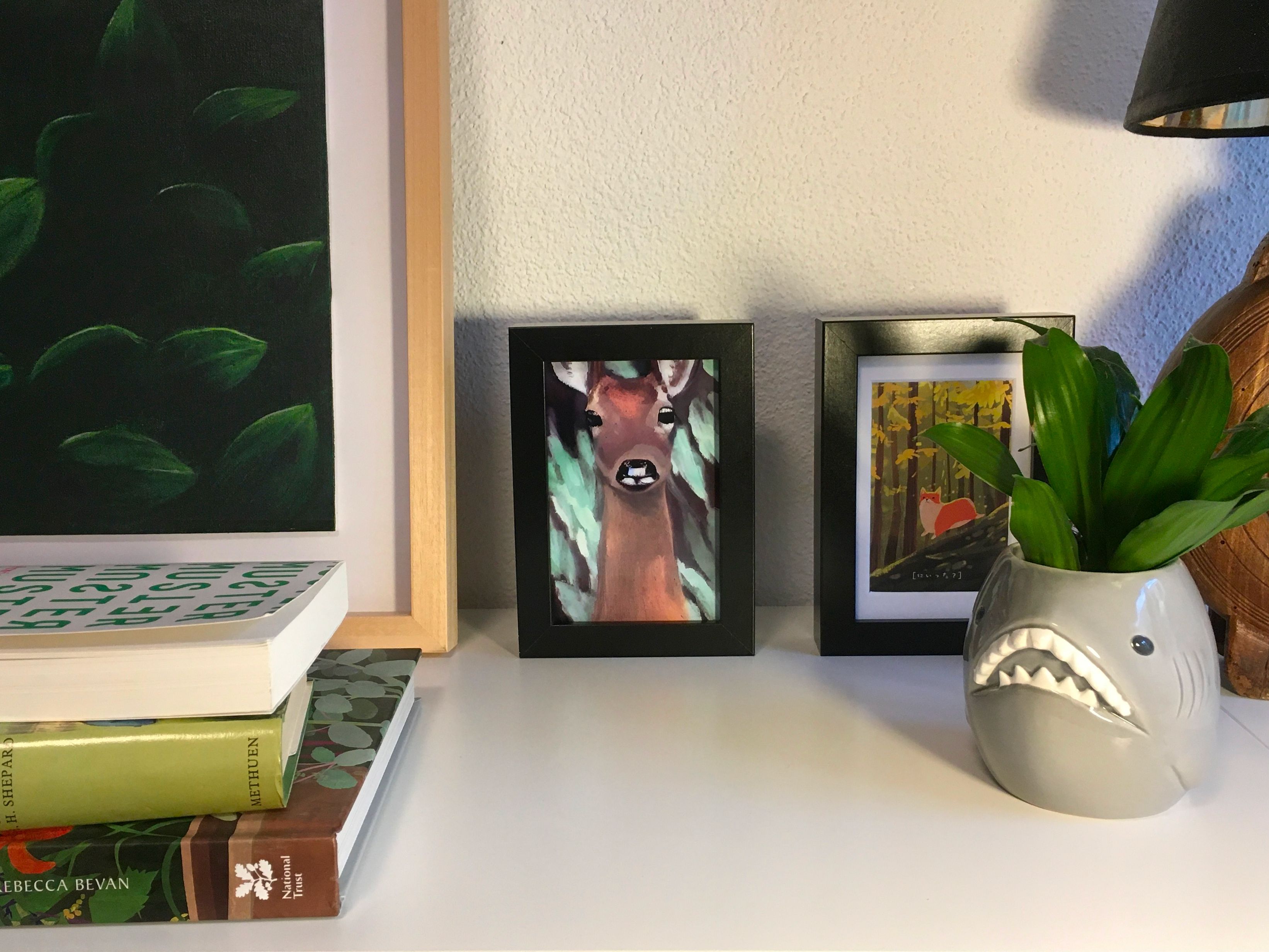 A real-life picture frame containing a drawing generated with Stable Diffusion